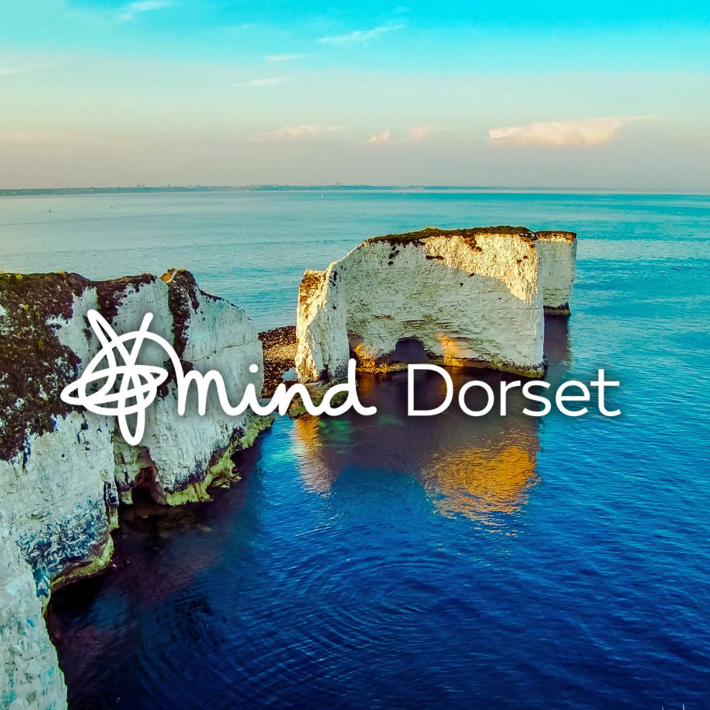 Home Page A photo of Old Harry's Rocks at Studland with the Dorset Mind text over the top