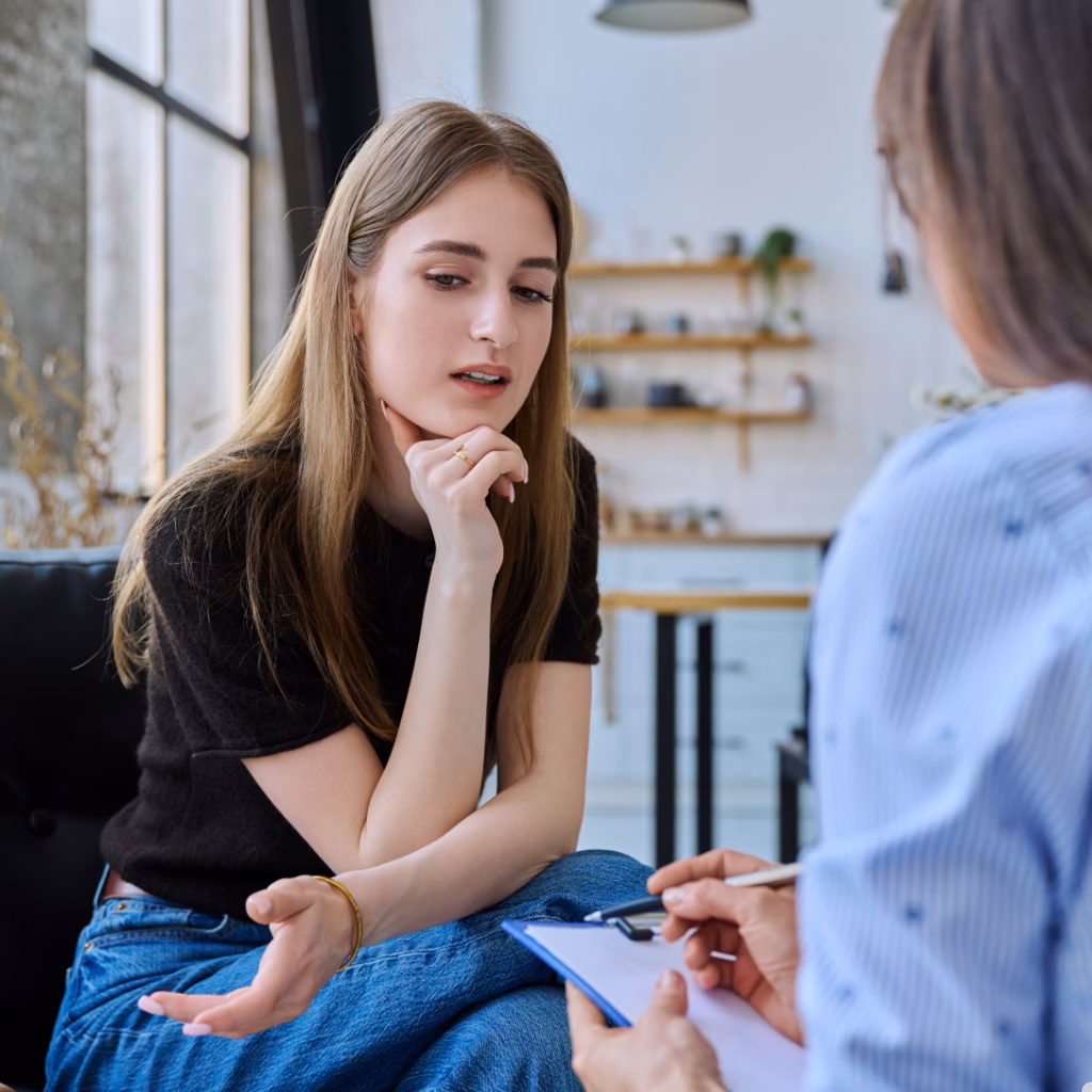 A teen girl in a counselling session